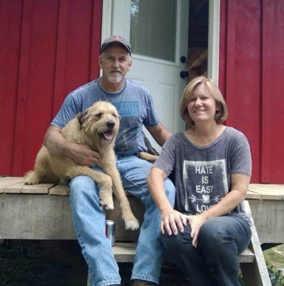 John and Mary relax on the porch of the West Virginia home they built on their 55 wooded acres
