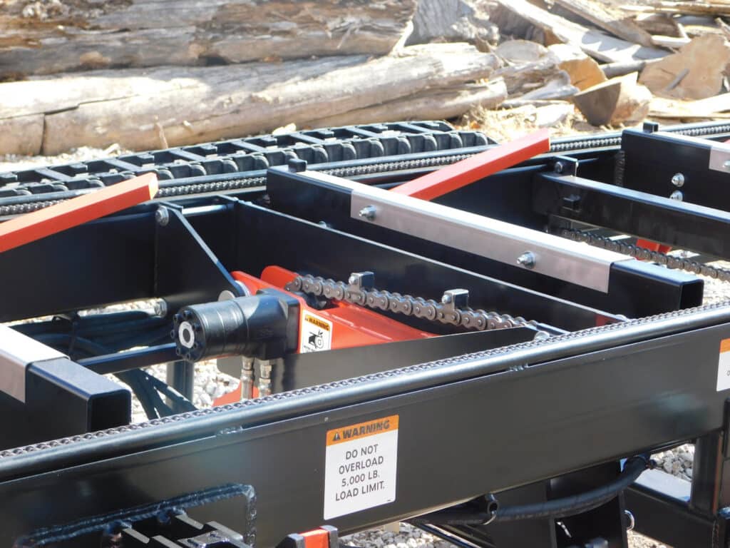 Keith snapped this pic of his mill's Bi-Directional Chain Log Turner system. You'd do the same if YOU had a brand-new TimberKing, wouldn't you?