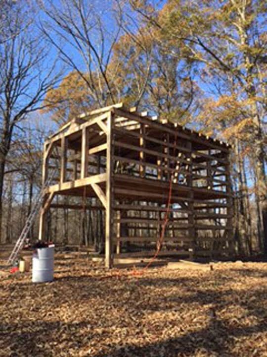 Billy's made progress -- much of the post-and-beam framework is in place.