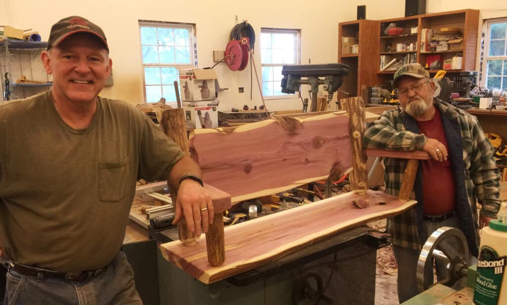 Bryan (left) and a buddy are members of "Iron & Fire" motorcycle club along with other EMTs and firefighters. Bryan makes and donates a bench like this one to help need families and kids with cancer.