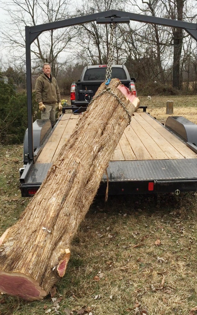 What would you pay for a cedar log like this one? Charles paid $0. He's bought only one log in the time he's been sawing. Folks are glad to have him haul them away.