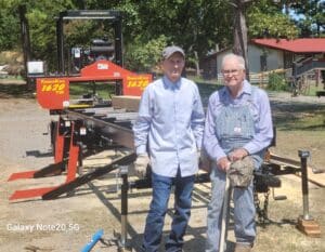 Daniel, his dad, and his brand new TimberKing