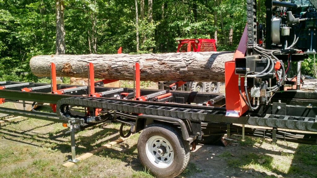 Dennis jumped right into sawing with this 18' long white oak log. 25" diameter at one end, 30" at the other end.