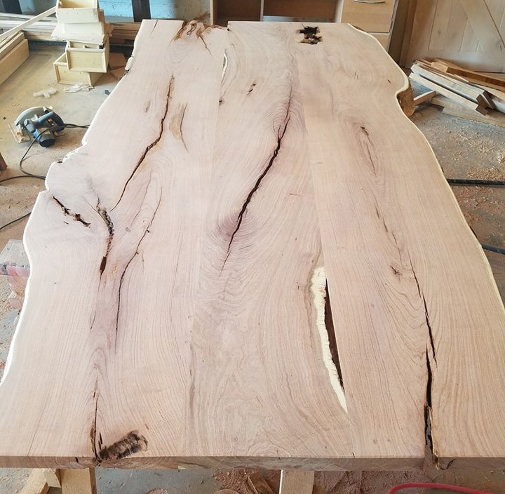 BEFORE -- This is one handsome dining room table. Solid wood with plenty of character.