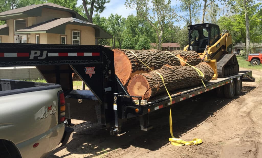 Big day at Ol' Doc's saw lot as he hauls in another big load of logs with his gooseneck trailer and dually.